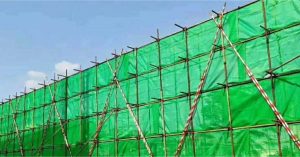 Why Construction Sites are Covered with Green Clothes